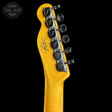 Guitar headstock with tuning pegs on a black background, featuring the Fender logo.