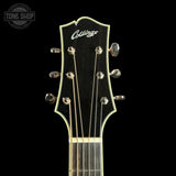 Guitar headstock with 'Collings' logo on a black background