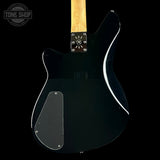 Ricken electric guitar body in glossy black with a maple neck, shown from the back against a black background. Features a chrome hardware plate and a Tone Shop watermark in the upper left corner.