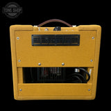 Yellow guitar amplifier with 'Tone Shop' logo in the corner