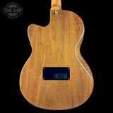 Wooden electric guitar body with 'Tone Shop' logo in the corner