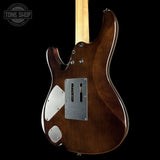 The back of a Fender Stratocaster electric guitar in a glossy dark brown finish, featuring a maple neck and silver hardware, shown against a solid black background with a Tone Shop watermark in the top left.