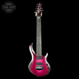 A high-end electric guitar with a vibrant magenta-to-purple sunburst finish, shown vertically against a solid black background. The brand 'Tone Shop' is watermarked in the top-left corner.