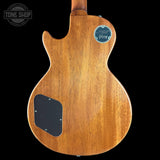 Back view of a wooden guitar with a visible brand logo on a black background