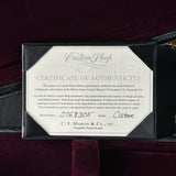 Certificate of Authenticity for a Martin guitar on a dark background