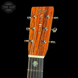 Gibson guitar headstock with brand name on a black background
