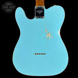 Blue electric guitar body with Fender logo on a black background