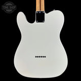 The back of a white electric guitar with a maple neck, shown against a solid black background. A Tone Shop watermark is visible in the top-left corner.