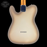 The back of a Fender Telecaster electric guitar with a cream-to-brown sunburst finish, shown against a solid black background. A Tone Shop watermark is visible in the top-left corner.
