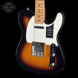 Fender Telecaster electric guitar in a sunburst finish, featuring a white pickguard, dual humbucker pickups, and a maple neck, shown against a black background.