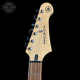 Close-up of a guitar headstock with 'Yamaha Pacifica' branding on a black background.