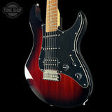 Electric guitar with a red and black finish on a black background, featuring the Tone Shop logo.