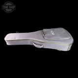 Gray guitar case with a brand logo on a black background