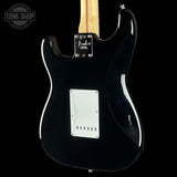 Rear view of a glossy black Fender Stratocaster electric guitar against a black background, showing the maple neck, white pickguard, and chrome hardware.