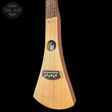 A natural wood soprano ukulele with a distinctive teardrop-shaped body, shown against a solid black background. The brand 'D'Angelo' is visible on the headstock, and a 'TONE SHOP' watermark is in the top-left corner.