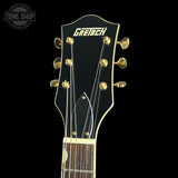 Gretsch guitar headstock on a black background