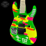 Colorful electric guitar with abstract design on a black background, featuring the brand 'Tone Shop'.