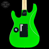 Green electric guitar with a black pickguard on a black background, featuring the Tone Shop logo.