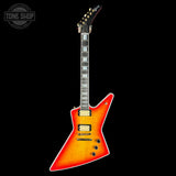 Electric guitar with a flame maple top on a black background, featuring the Tone Shop logo.