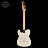 A Fender Telecaster-style electric guitar shown from the back, featuring a natural wood neck and a cream-colored body, photographed against a solid black background with a Tone Shop watermark in the top-left corner.
