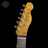 Guitar headstock with brand logo on a black background