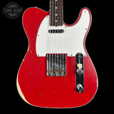 Red electric guitar with white pickguard on a black background, featuring 'Tone Shop' logo.