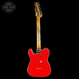 Red electric guitar with a visible brand logo on a black background