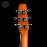 Guitar headstock with tuning pegs on a black background, featuring 'Tone Shop' logo.