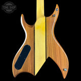 Close-up of the back of an electric guitar body made from two distinct wood tones: a warm medium-brown wood on the sides and a pale yellow maple wood center stripe, set against a solid black background.