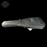 Black guitar case with visible branding on a black background