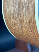 Close-up of a wooden surface with a visible scratch.