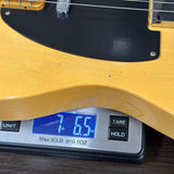 Fender Custom Shop 1951 Nocaster Journeyman Relic Aged Nocaster Blonde on scale displaying weight.