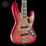 A fender jazz bass guitar with a red and green paisley patterned finish, shown against a solid black background. The brand 'Tone Shop' is watermarked in the top-left corner.