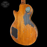 The back of a vintage Fender electric guitar with a heavily distressed orange-brown sunburst finish, showing the black pickguard and circular 'Fender Custom '59 Strat' inlay. A Tone Shop watermark is visible in the top left corner.