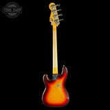 A classic electric guitar shown from the back, featuring a sunburst finish that transitions from bright yellow-orange to dark red and black, with a light wood neck and headstock, photographed against a solid black background.