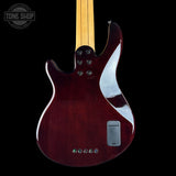 Guitar body with a glossy finish on a black background, featuring the Tone Shop logo.