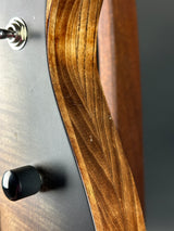 Close-up of a guitar's soundhole and wooden body