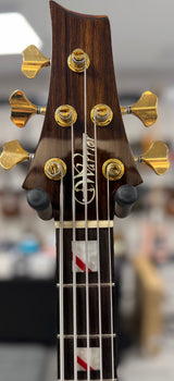 Front of headstock of Used Warrior Kings Closet Isabella 5-String Bass Red Alligator Top w/Bag TSS6755