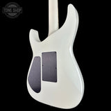White electric guitar body on a black background with 'Tone Shop' logo.