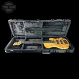 Open guitar case with a bass guitar inside, featuring 'Tone Shop' branding.