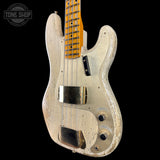 A Fender Stratocaster-style electric bass guitar with a heavily distressed, weathered cream finish and a natural wood fretboard, shown against a solid black background.