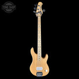 Electric bass guitar with a natural wood finish on a black background, featuring the Tone Shop logo.