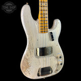 A Fender Stratocaster electric bass guitar with a heavily distressed, weathered white finish and a natural wood neck, shown against a solid black background.