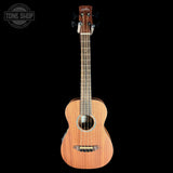Acoustic guitar on a black background with 'Tone Shop' logo.