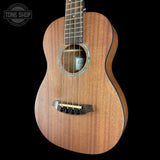 Wooden ukulele with a black background