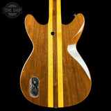 Wooden guitar body with a visible brand logo in the corner