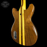 Wooden guitar body with a yellow stripe on a black background, featuring 'Tone Shop' logo.