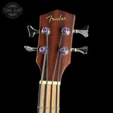 Fender guitar headstock with tuning pegs on a black background