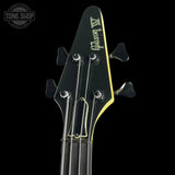 Bass guitar headstock on a black background