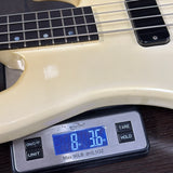 Digital scale displaying weight of a guitar neck